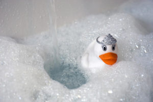 Toy duck in bubble bath