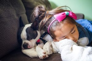 Girl sleeping with a dog